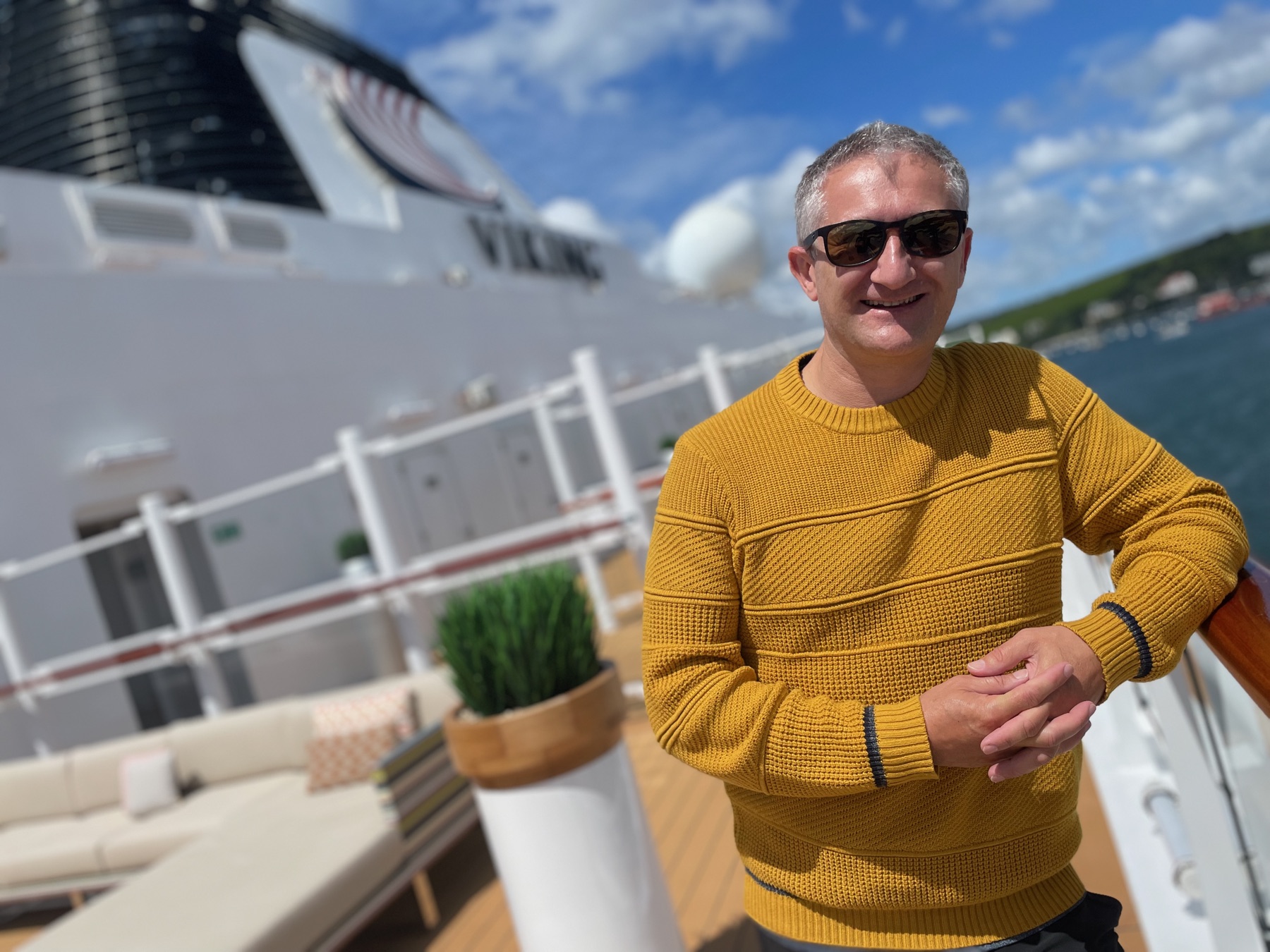 David smiling on the deck of a cruise ship